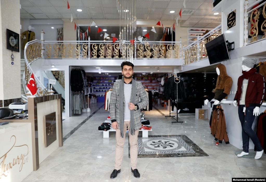 Owner of a luxury clothes shop Sohail Ataie, 22. "We are tired of war. What we want is peace, to live a better life."
