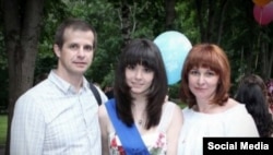 Varvara Karaulova with her parents, who say they were not particularly surprised by their daughter's interest in learning Arabic.