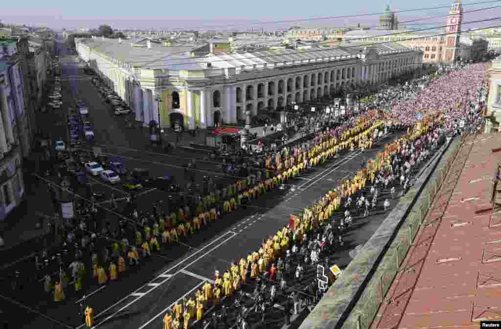 Russian Orthodox believers take part in a September 12 procession along St. Petersburg's Nevsky Prospect to mark the 300th anniversary of the city's Aleksandr Nevsky Monastery. 