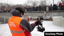 An AirPano drone being deployed during protests on Moscow's Bolotnaya Square in December 2011.