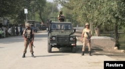 FILE: Army soldiers stand guard in Khyber tribal district.