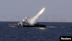 A medium-range missile is test-fired by Iran near the Strait of Hormuz in 2012.