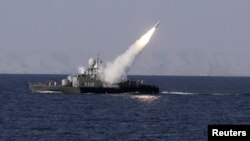 A medium-range missile is test-fired by Iran near the Strait of Hormuz in 2012.