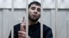 Zaur Dadayev, charged with involvement in the murder of Russian opposition figure Boris Nemtsov, speaks inside a defendants' cage in Moscow on March 8.