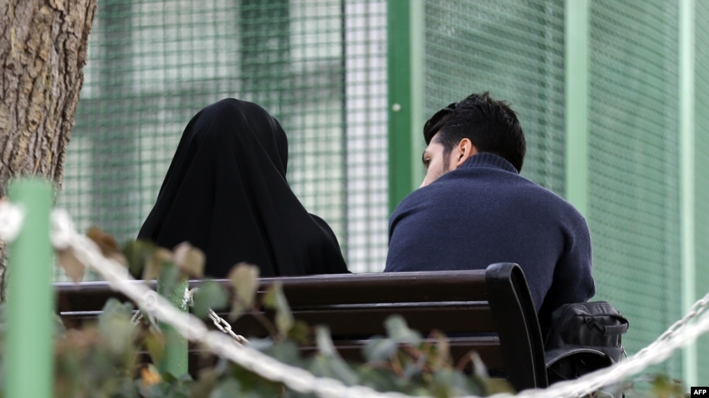 An Iranian couple sit in a park in the capital Tehran on March 14, 2017. File photo