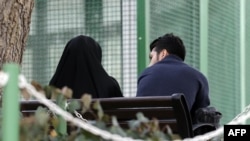 An Iranian couple sit in a park in the capital Tehran on March 14, 2017. File photo