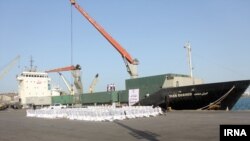 Iranian Red Crescent workers upload aid onto the 'Iran Shahed' cargo ship to send to Yemen. May 2015, Iran. File photo