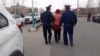 Kazakhstan - Police officers are detaining Akhzhan Nogayeva who has performed in front of the city administration building. 1 April 2020