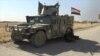 Iraqi troops advancing past villages on their way toward Mosul on October 21, 2016.