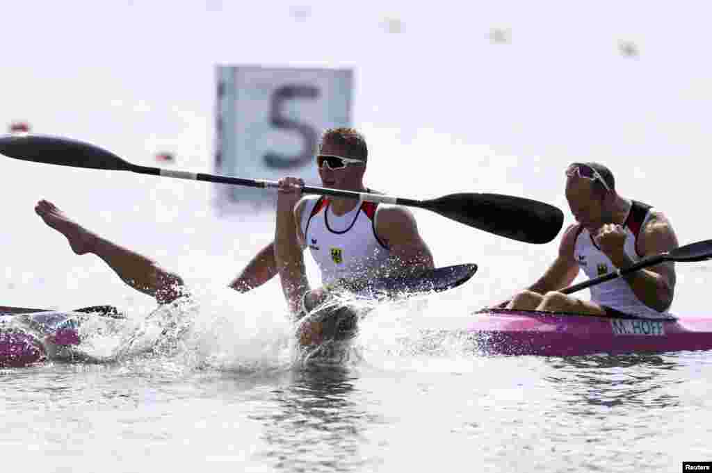 Max Rendschmidt of Germany leaps from his boat after his team won gold in the men's kayak K-4 1,000-meter final. Slovakia narrowly beat the Czech Republic to grab the silver.