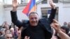 Armenia - Opposition leader Sasun Mikaelian receives a hero's welcome after being released from prison, 27May2011.