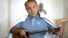 Kazakh President Nursultan Nazarbaev playing the dombra, a national instrument of Kazakhstan.