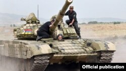 Nagorno-Karabakh - Armenian Prime Minister Tigran Sarkisian drives a tank near Karabakh Armenian frontline positions, 02Aug2011.