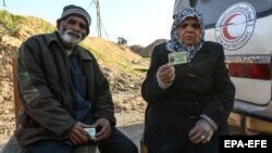 Mohammad Fadhl Akram, 73, and his 62-year-old wife, Saghran Bibi, were transferred from the eastern Ghouta town of Douma to Damascus.