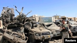 Members of the Afghan security force keep watch at the site of a suicide bomb attack in the central Ghazni Province early in September.