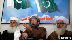 Taliban negotiators speak during a news conference in Islamabad on February 4, 2014