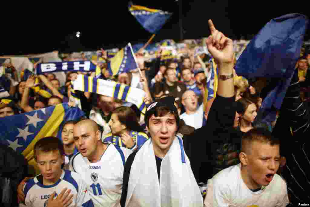 Fans of Bosnia-Herzegovina's national soccer team celebrate their 2014 World Cup qualifying match victory over Lithuania, in Sarajevo. (Reuters/Dado Ruvic)