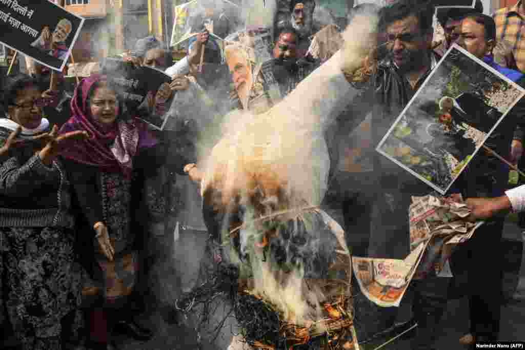 Protesters in Amritsar shout slogans as they burn an effigy of Indian Prime Minister Narendra Modi during a demonstration against religious violence in New Delhi on February 26. (AFP/Narinder Nanu)