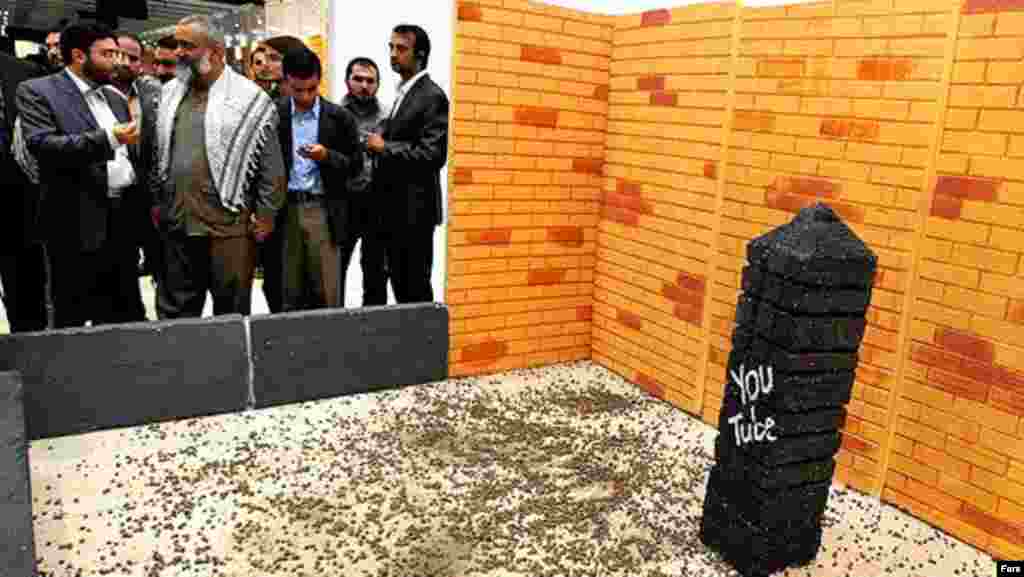 A symbolic stoning of YouTube takes place at the Digital Media Exhibition in Tehran in November 2011. (Fars)