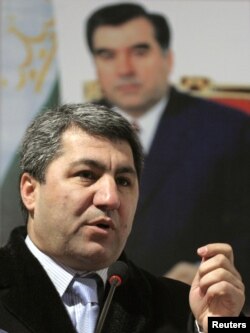 Kabiri speaks in front of a portrait of President Emomali Rahmon during an election campaign meeting in Dushanbe in February 2010.