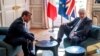 French President Emmanuel Macron and British Prime Minister Boris Johnson speak during a meeting at the Elysee Palace in Paris, August 22, 2019