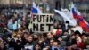 A protester holds a placard reading "Putin - No!" during an opposition rally in central Moscow in March 2019 to demand Internet freedom in Russia.