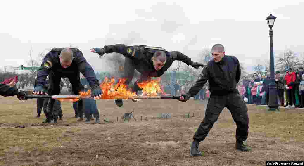 Servicemen with the Belarusian Interior Ministry&#39;s special forces perform as they mark Internal Forces Day in Minsk on March 17. (Reuters/Vasily Fedosenko)