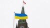 CANADA – The Ukrainian flag is seen in front of the Peace Tower on Parliament Hill after Ukraine's President Volodymyr Zelensky addressed Canada's parliament in Ottawa, Ontario, Canada, March 15, 2022
