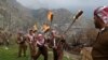 Iraqi Kurds mark Norouz with a torch-lit procession up a mountain above the town of Aqrah, some 100 kilometers east of Mosul.