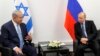Israeli Prime Minister Benjamin Netanyahu (left) meets with Russian President Vladimir in Moscow on January 29.