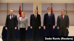 Bosnian presidency Chairman Dragan Covic (center) and members Bakir Izetbegovic (left) and Mladen Ivanic (right) pose for a photo with Croatian President Kolinda Grabar Kitarovic (2nd left) and Serbian President Aleksandar Vucic (2nd right) after talks in Mostar on March 6.