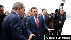 Armenia - Businessman Davit Ghazarian (C) shows Prime Minister Nikol Pashinian around a newly built dairy factory of his Spayka company, Yerevan, March 26, 2019.