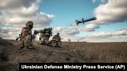 In this image released by the Ukrainian Defense Ministry Press Service, Ukrainian soldiers launch U.S.-made Javelin anti-tank missiles during military exercises in the Donetsk region on December 23.