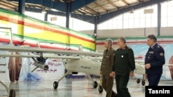 Iran Defense Minister Brigadier-General Amir Hatami (left) reviewing the Mohajer-6 drone. February 5, 2018. 
