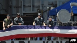 Sailors aboard the U.S. aircraft carrier "Carl Vinson" shortly after arriving at Manila Bay.