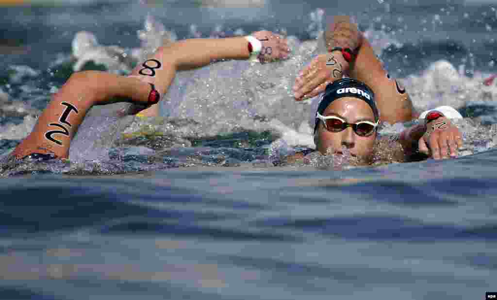 Rachele Bruni of Italy swims to a silver medal in the women's 10-kilometer marathon. Sharon van Rouwendaal of the Netherlands won gold.