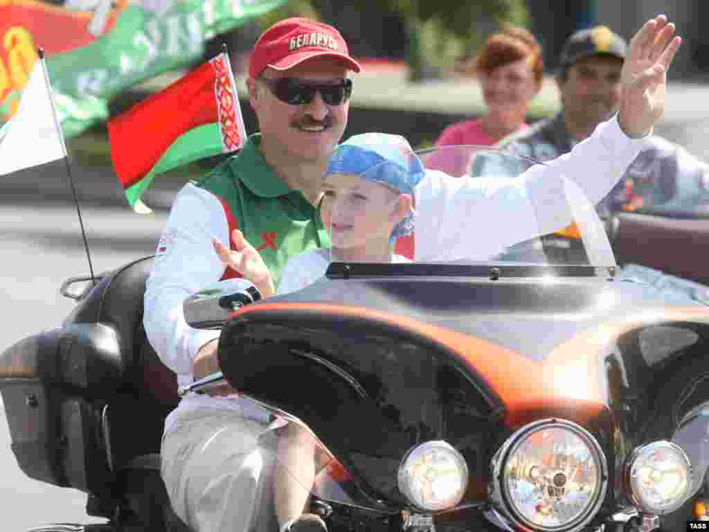 Riding a Harley, Lukashenka and Kolya take part in a motorbike festival in Minsk in July 2009. 