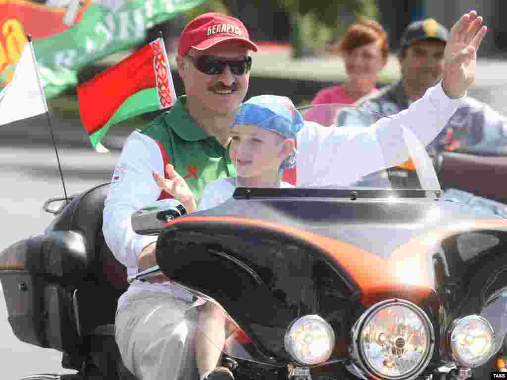Riding a Harley, Lukashenka and Kolya take part in a motorbike festival in Minsk in July 2009.