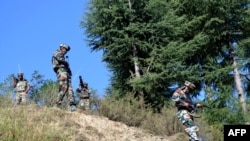 Indian army soldiers taking part in a gun battle with militants in October 2015.