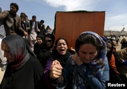 Women's rights activists carry the coffin of Farkhunda Malikzada, who was beaten to death by a mob in Kabul in 2015 after being falsely accused of burning a copy of the Koran.