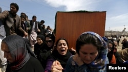 Afghan women's rights activists carry the coffin of Farkhunda during her burial ceremony in Kabul in March.