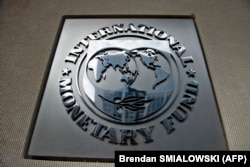 The International Monetary Fund's logo as seen outside its headquarters in Washington. (file photo)