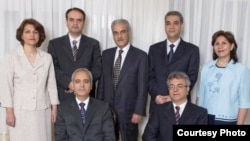 A group portrait of the seven Baha'is who were arrested last year -- (seated from left) Behruz Tavakkoli and Saeid Rezaie (standing) Fariba Kamalabadi, Vahid Tizfahm, Jamaloddin Khanjani, Afif Naeimi, and Mahvash Sabet. (Baha'i World News Service)