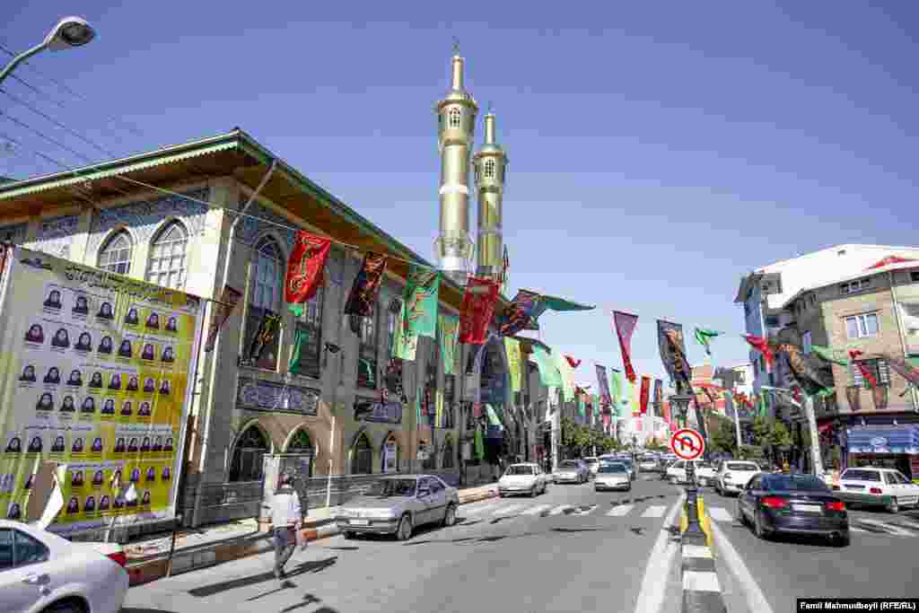 Banners with the names of Shia imams hang above the street outside the Abrava Mosque in Iranian Astara during the month of Muharram -- the first month of the year on the Islamic calendar, and one of the four sacred months.