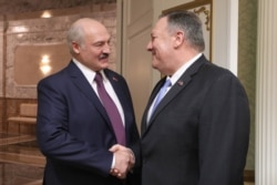 Belarusian President Alyaksandr Lukashenka (left) meets with U.S. Secretary of State Mike Pompeo in Minsk on February 1.