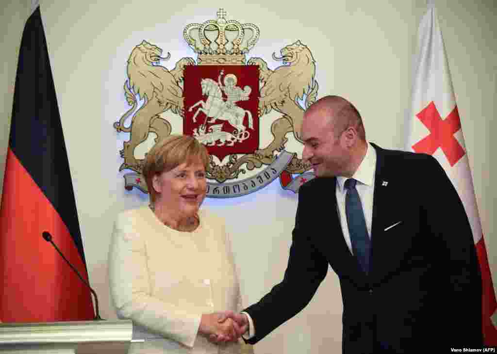 Германия канцлері Ангела Меркельдің Тбилисиде Грузия сыртқы істер министрі Михаил Джанелидземен кездескен сәті.