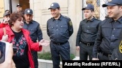 The Freedom House report mentioned the detention of investigative journalist and RFE/RL contributor Khadija Ismayilova (left) in its criticism of Azerbaijan's media space. (file photo)