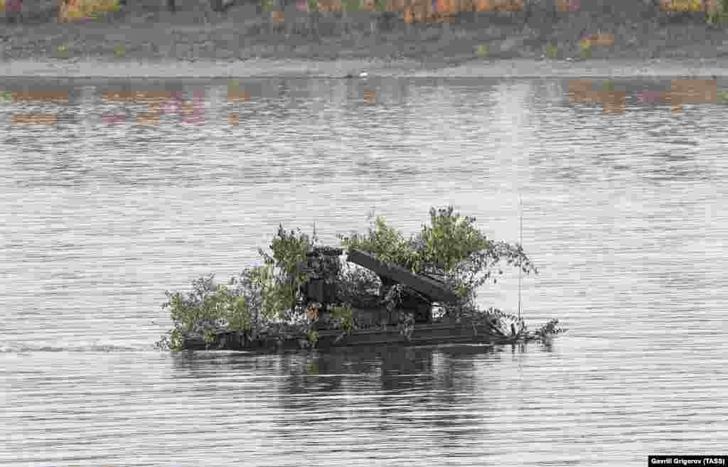 An Osa missile-launch vehicle crossing the Tom River.