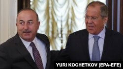 Turkish Foreign Minister Mevlut Cavusoglu (left) meets with Russian Foreign Minister Sergei Lavrov in Moscow in August.