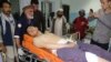 An Afghan victim receives medical treatment after separate suicide bombings at an education center and a wrestling club in a predominantly Shi’ite neighborhood of Kabul earlier this month.